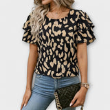 Lela - Blusa estilosa com mangas de pantera